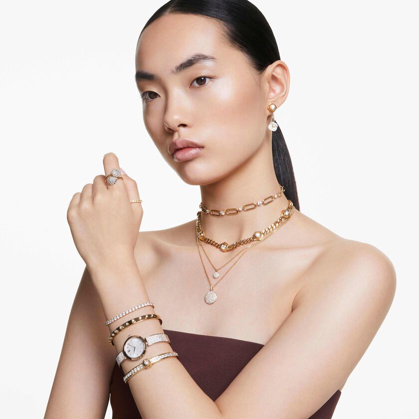 swarovski illumina watch  swiss made  metal bracelet  gold tone  champagne gold tone finish