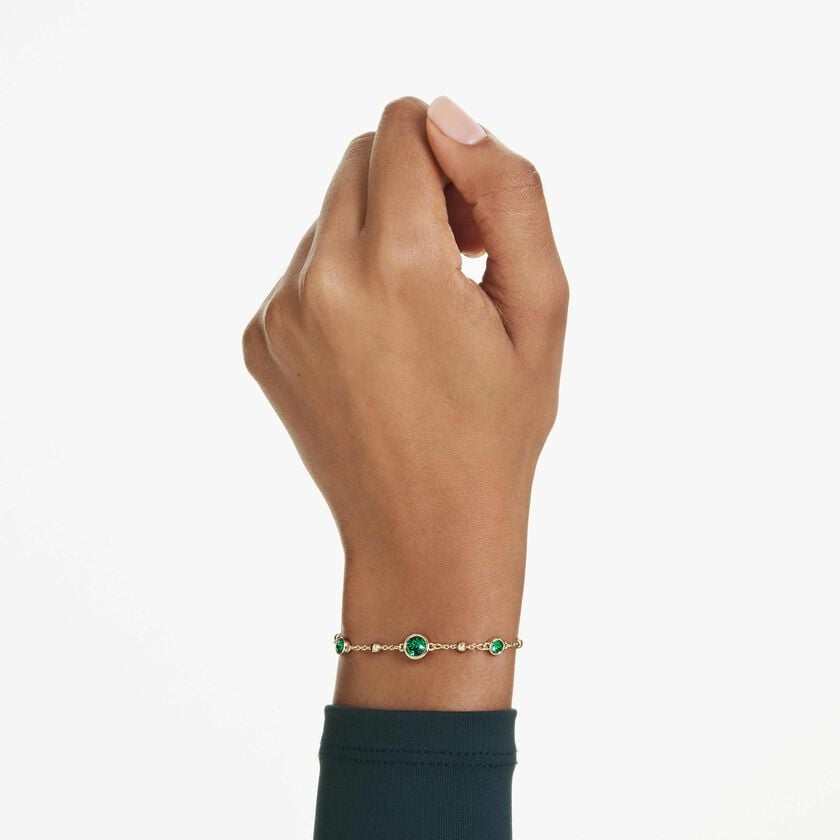 swarovski imber bracelet  round cut  green  gold tone plated